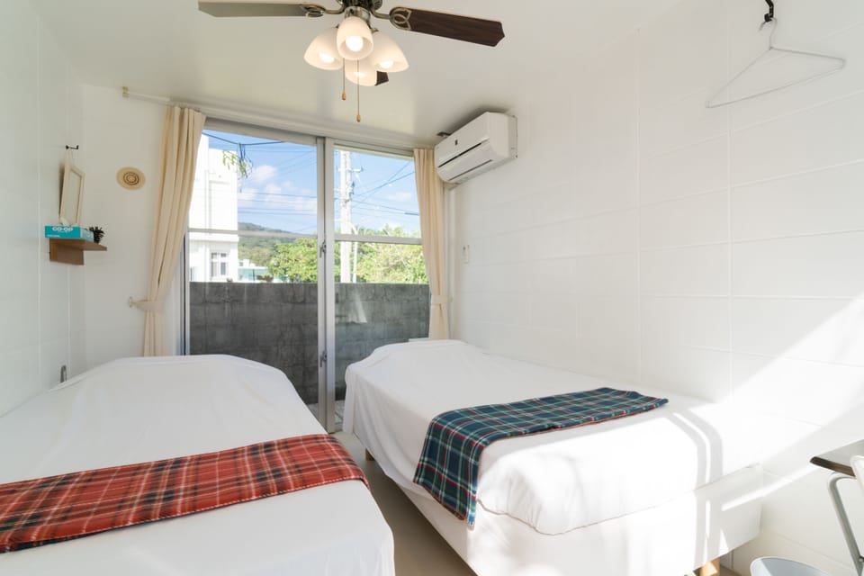 Twin Room, Shared Bathroom | In-room safe, WiFi (free), bed sheets