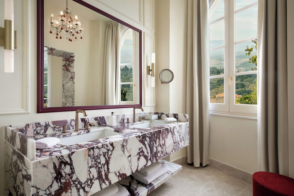Deluxe Suite | Bathroom | Deep soaking tub, free toiletries, hair dryer, slippers