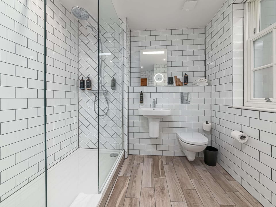 Apartment, 1 Double Bed | Bathroom | Combined shower/tub, eco-friendly toiletries, hair dryer, towels