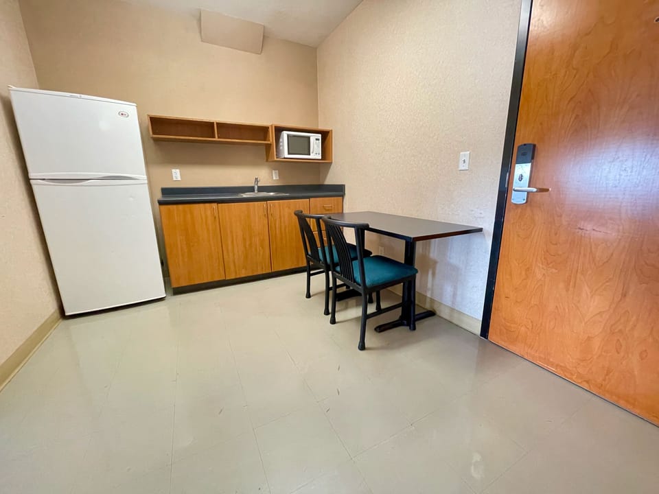 Suite, 2 Bedrooms | Private kitchen | Full-size fridge, microwave
