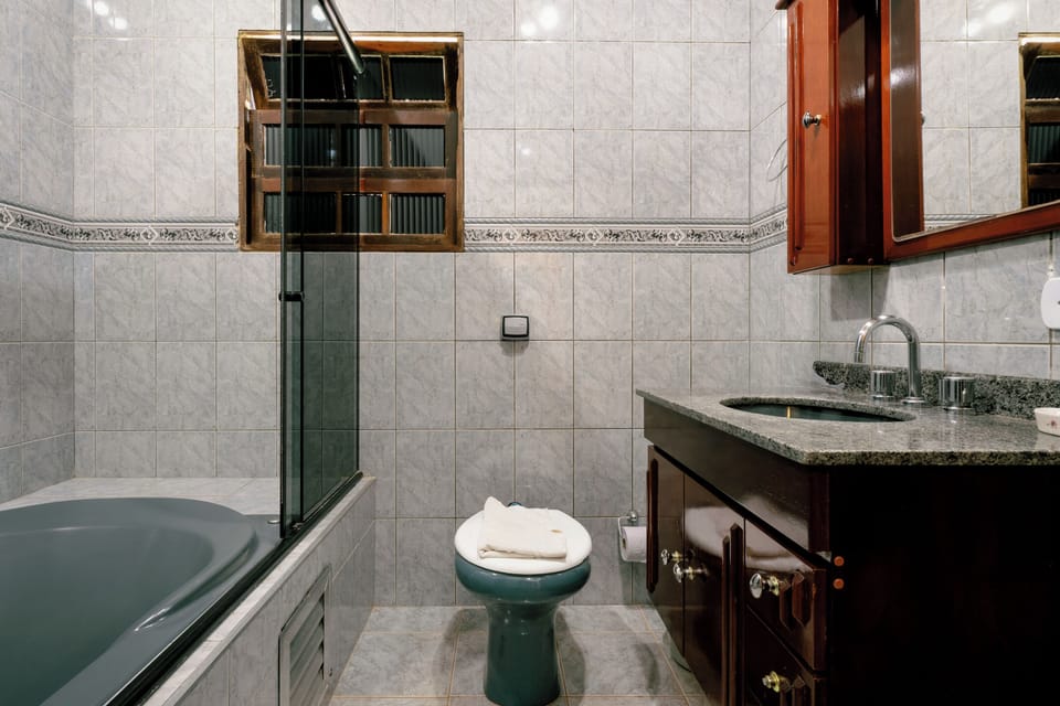 Luxury Room | Bathroom | Designer toiletries, slippers, towels, soap