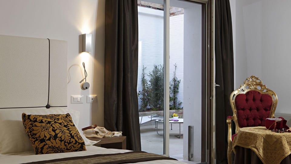 Superior Double Room, Patio | Down comforters, minibar, in-room safe, desk