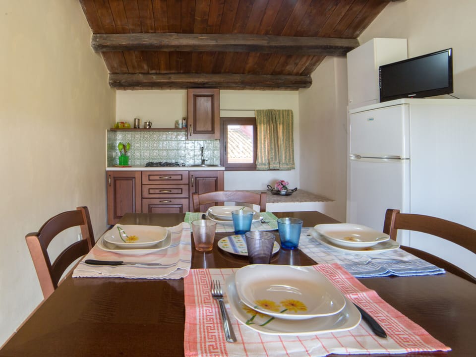 Apartment, 2 Bedrooms | Private kitchen | Full-size fridge, stovetop, coffee/tea maker, highchair