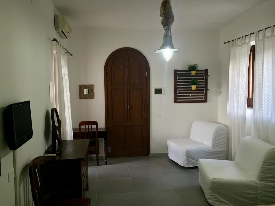 Standard Triple Room, Kitchenette | In-room safe, desk, bed sheets