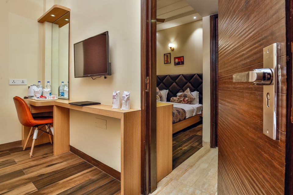 Deluxe Quadruple Room, Multiple Bedrooms, Smoking | Minibar, in-room safe, desk, blackout drapes