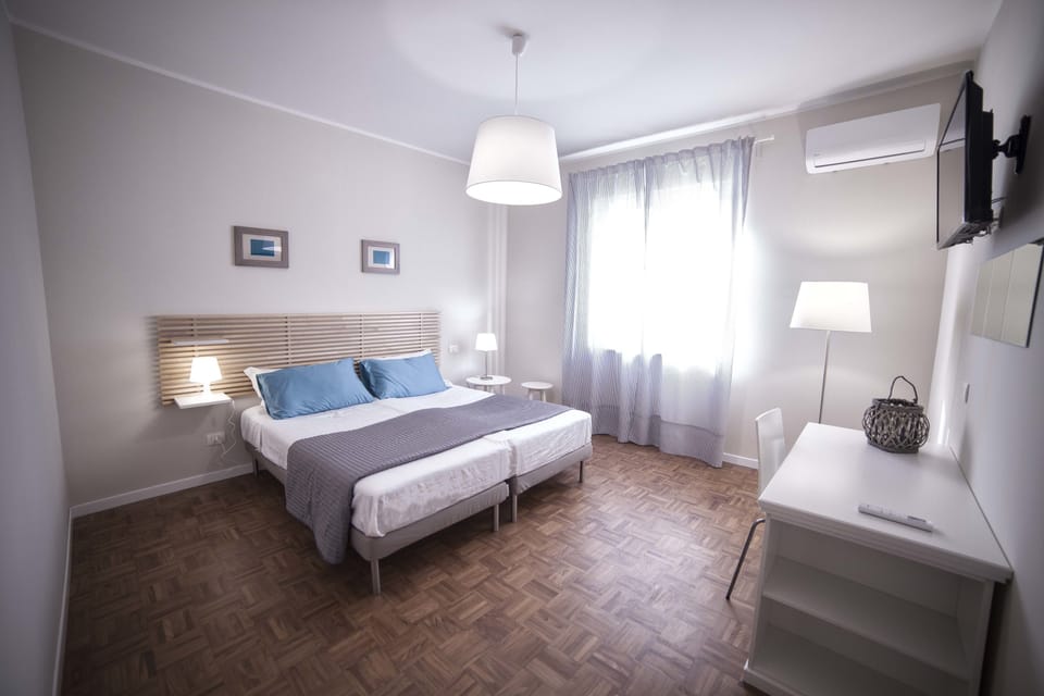 Double or Twin Room | Minibar, in-room safe, desk, blackout drapes