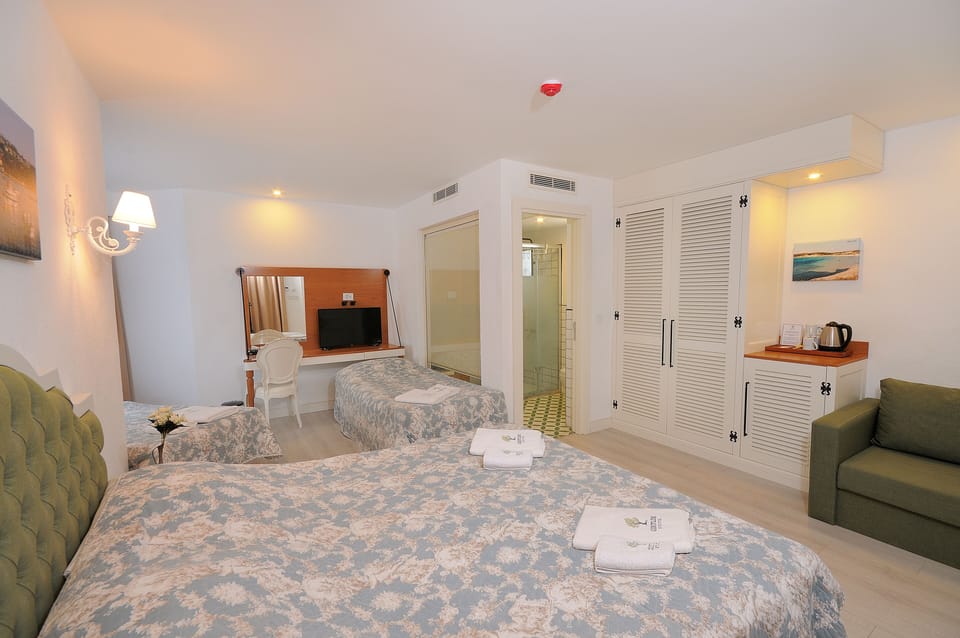Family Room | Free minibar items, in-room safe, desk, laptop workspace
