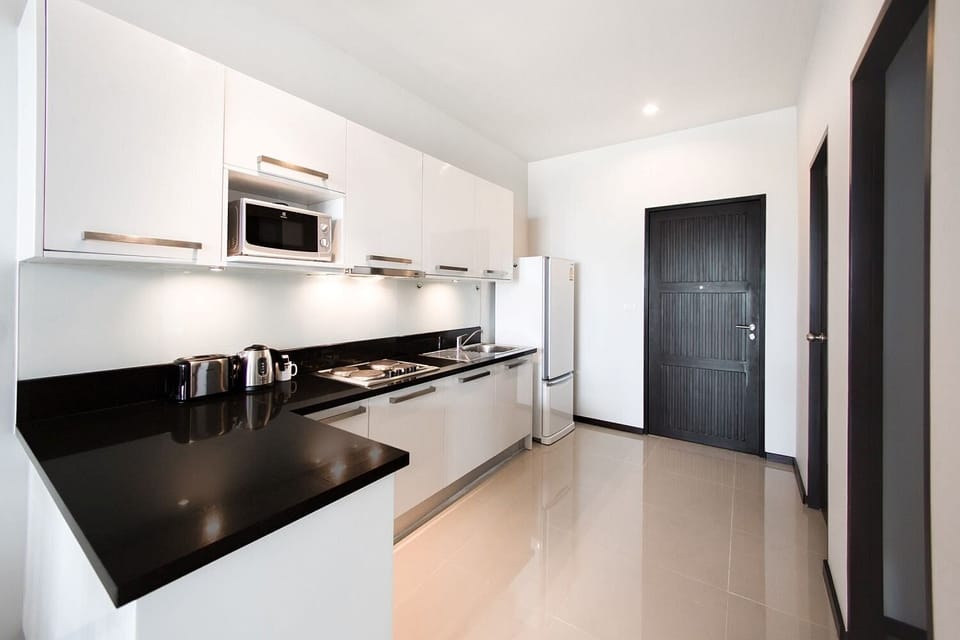 Villa | Private kitchen | Coffee/tea maker, full-size fridge, microwave, stovetop