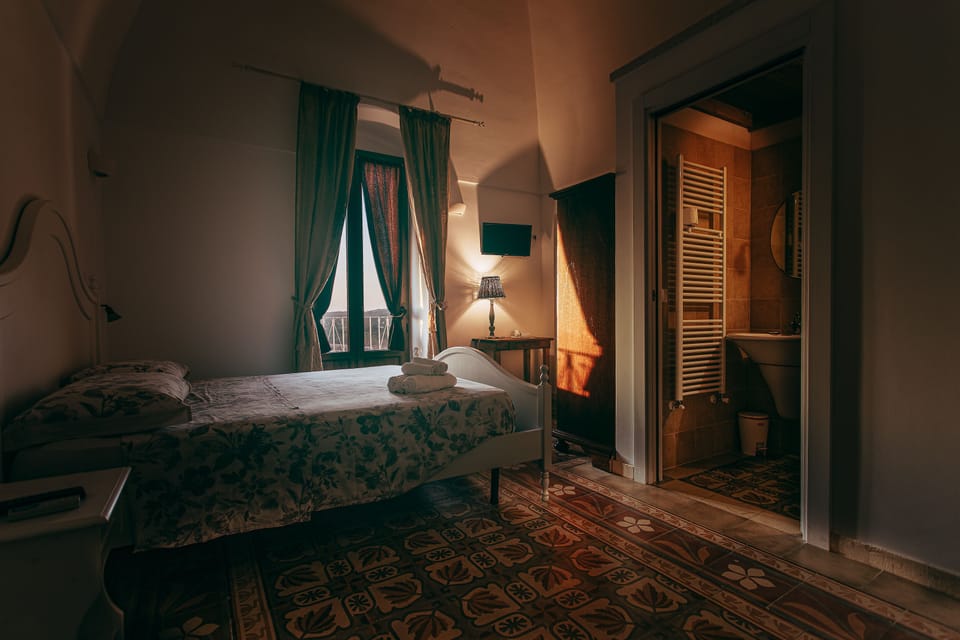 Comfort Quadruple Room, Private Bathroom | Minibar, desk, bed sheets