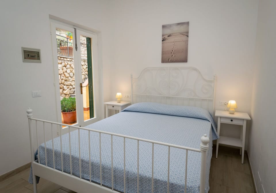 Economy Double Room, Balcony | Minibar, in-room safe, desk, free WiFi