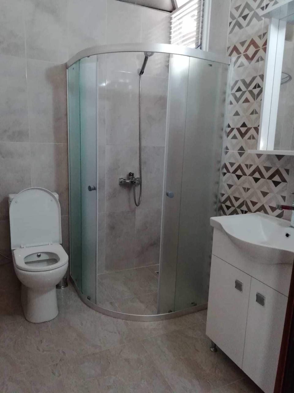 Shower, hair dryer, slippers, towels