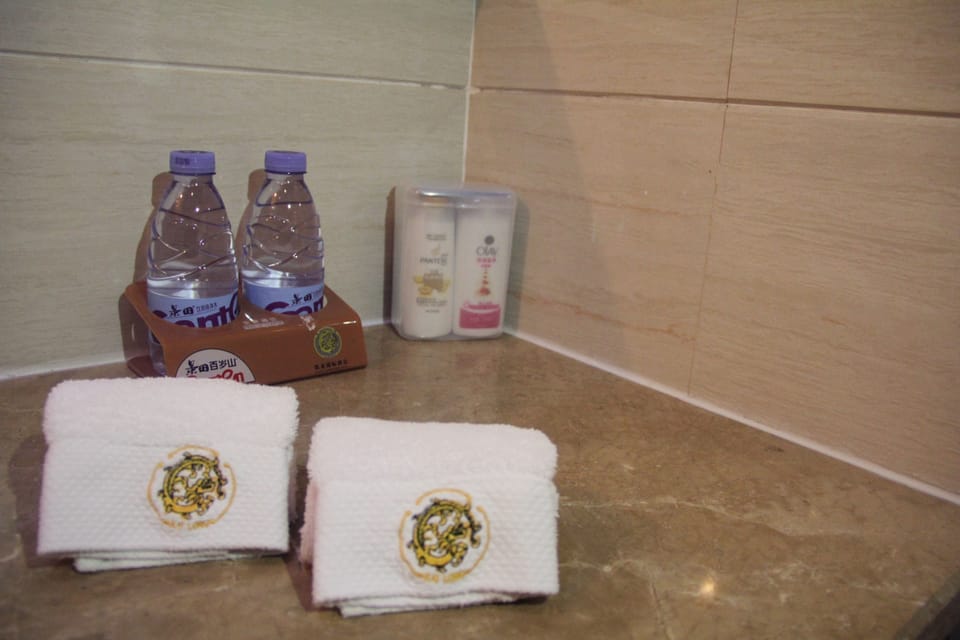 Shower, free toiletries, hair dryer, slippers