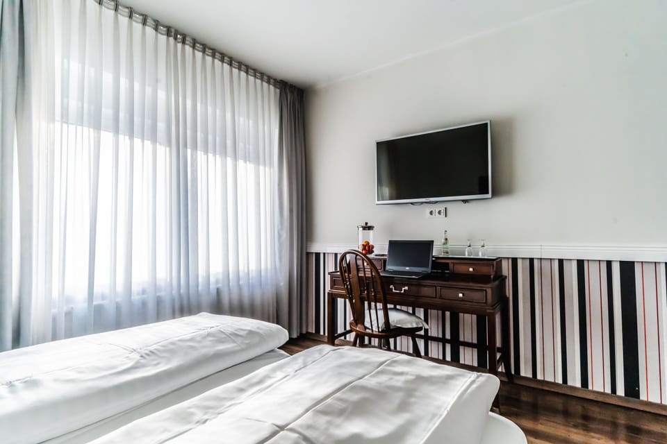 Superior Double Room, Private Bathroom (Schlafgut) | Desk, blackout drapes, iron/ironing board, free cribs/infant beds