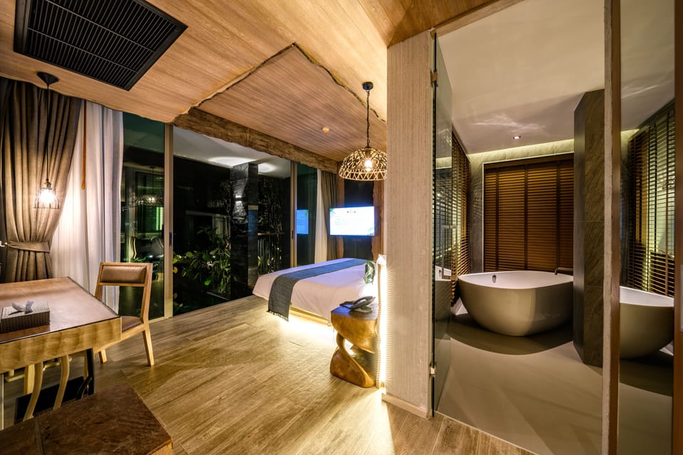 Two Bedroom Family Pool Suite | Minibar, in-room safe, desk, blackout drapes