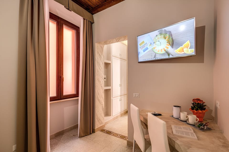 Economy Double Room, Non Smoking | Living area | 42-inch Smart TV with satellite channels, TV, first-run movies