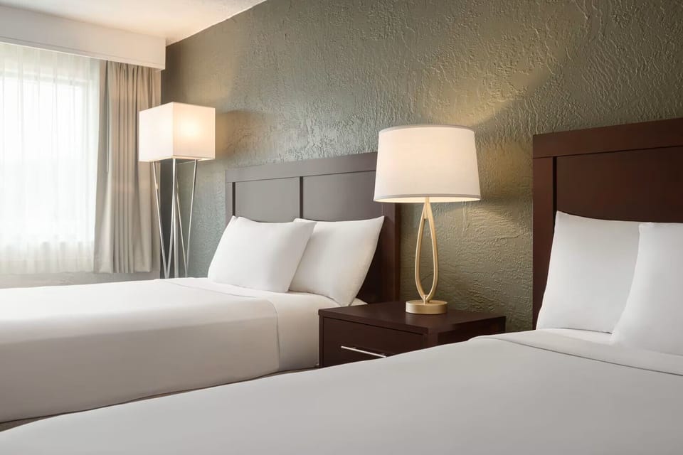 Pool View Double Double | Hypo-allergenic bedding, in-room safe, desk, laptop workspace