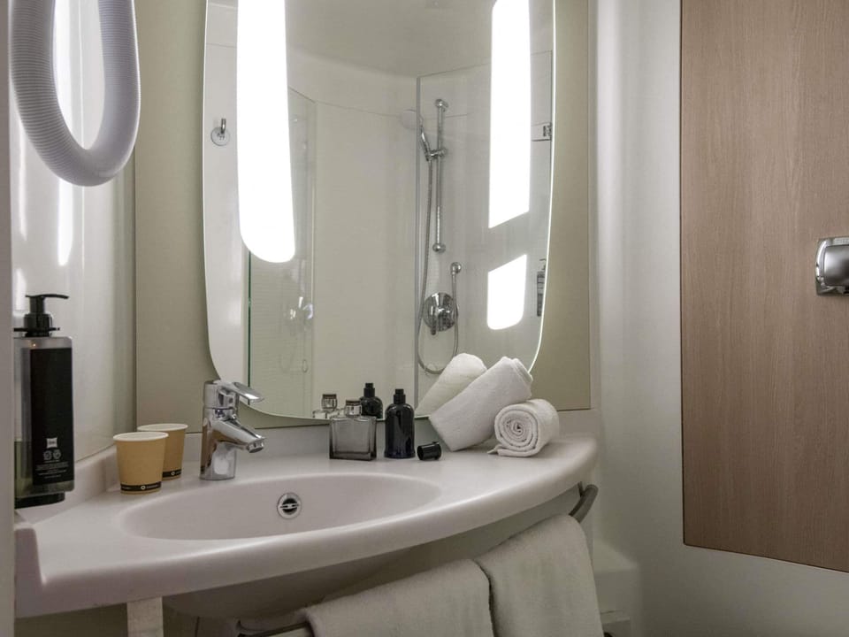 Shower, eco-friendly toiletries, hair dryer, towels