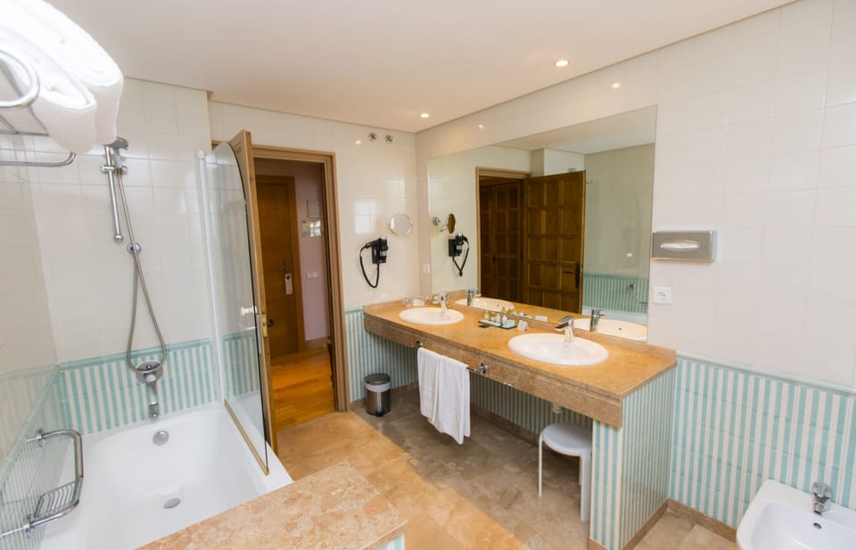 Bathtub, eco-friendly toiletries, hair dryer, bidet