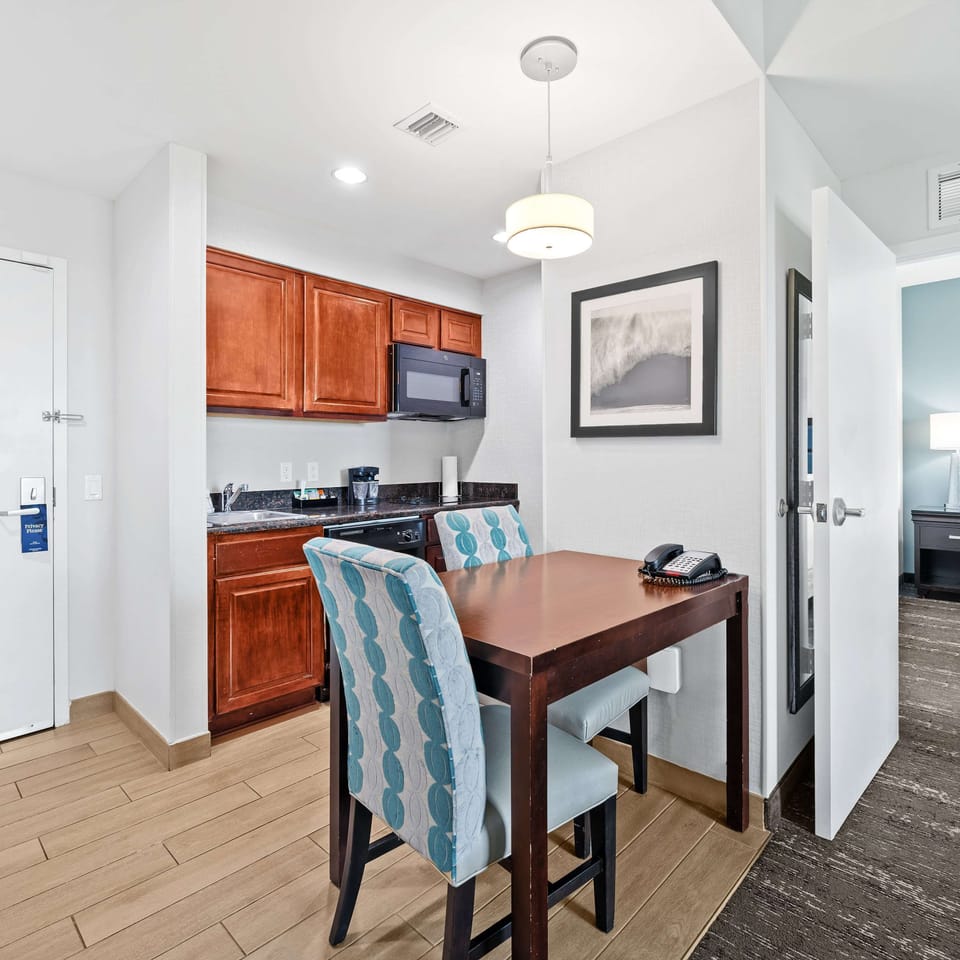 Suite, 1 King Bed | Private kitchen | Full-size fridge, microwave, coffee/tea maker, cookware/dishes/utensils