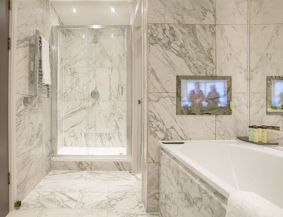 Designer toiletries, hair dryer, towels, soap