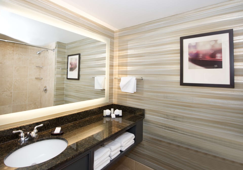 Designer toiletries, hair dryer, towels, soap