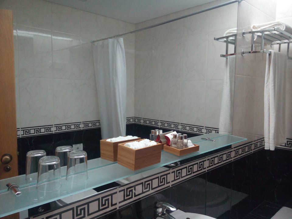 Combined shower/tub, free toiletries, hair dryer, bathrobes