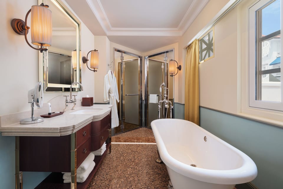 Shower, designer toiletries, hair dryer, bathrobes