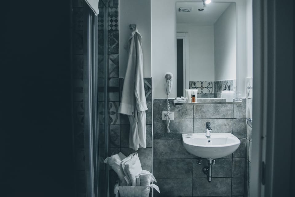 Basic Double Room | Bathroom | Shower, rainfall showerhead, free toiletries, hair dryer