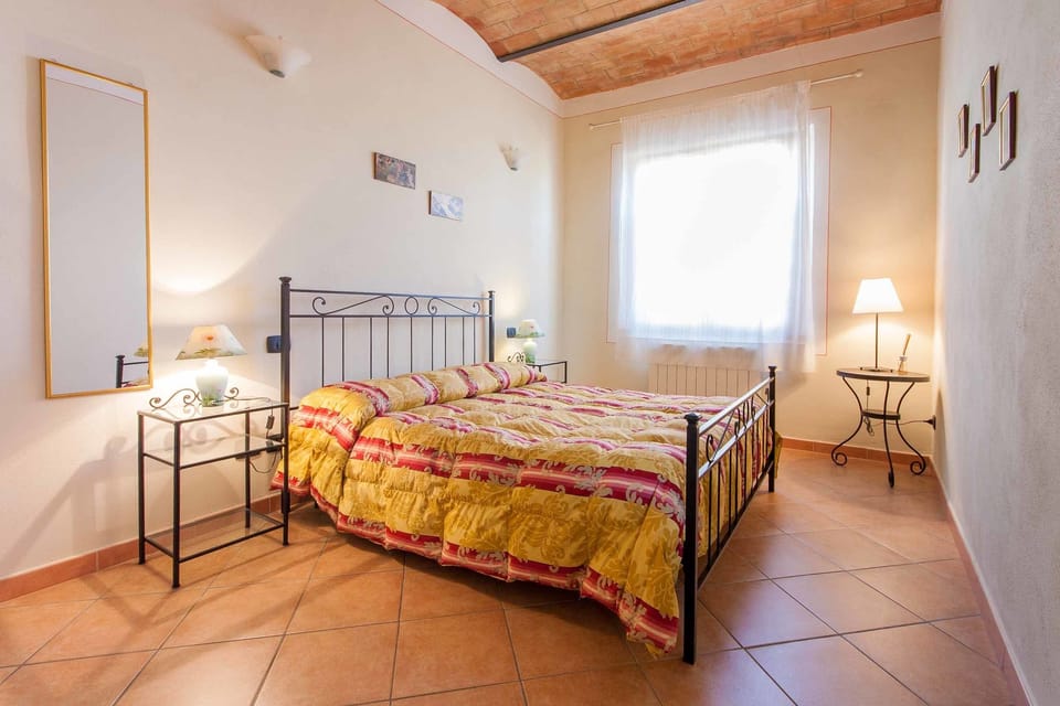 Apartment, 1 Bedroom (Le Volticine) | Blackout drapes, iron/ironing board, WiFi (free), bed sheets