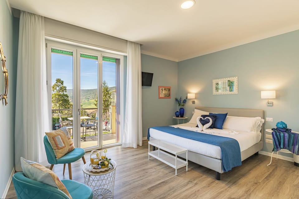 Deluxe Room, Balcony | 1 bedroom, premium bedding, down comforters, minibar