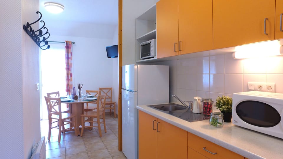 Fridge, microwave, electric kettle, cookware/dishes/utensils