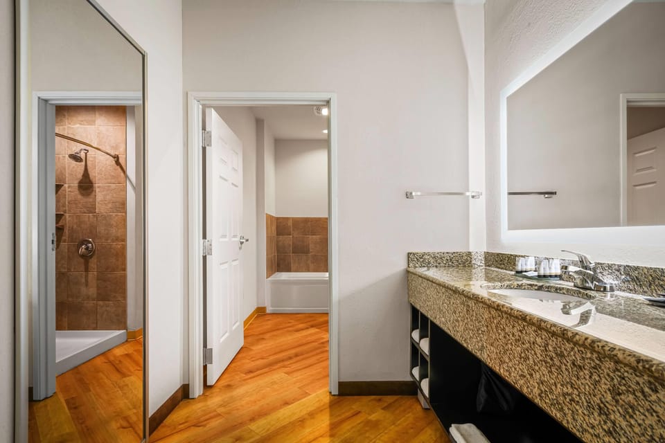 Suite, Multiple Beds (Various Views) | Bathroom | Shower, hair dryer, towels