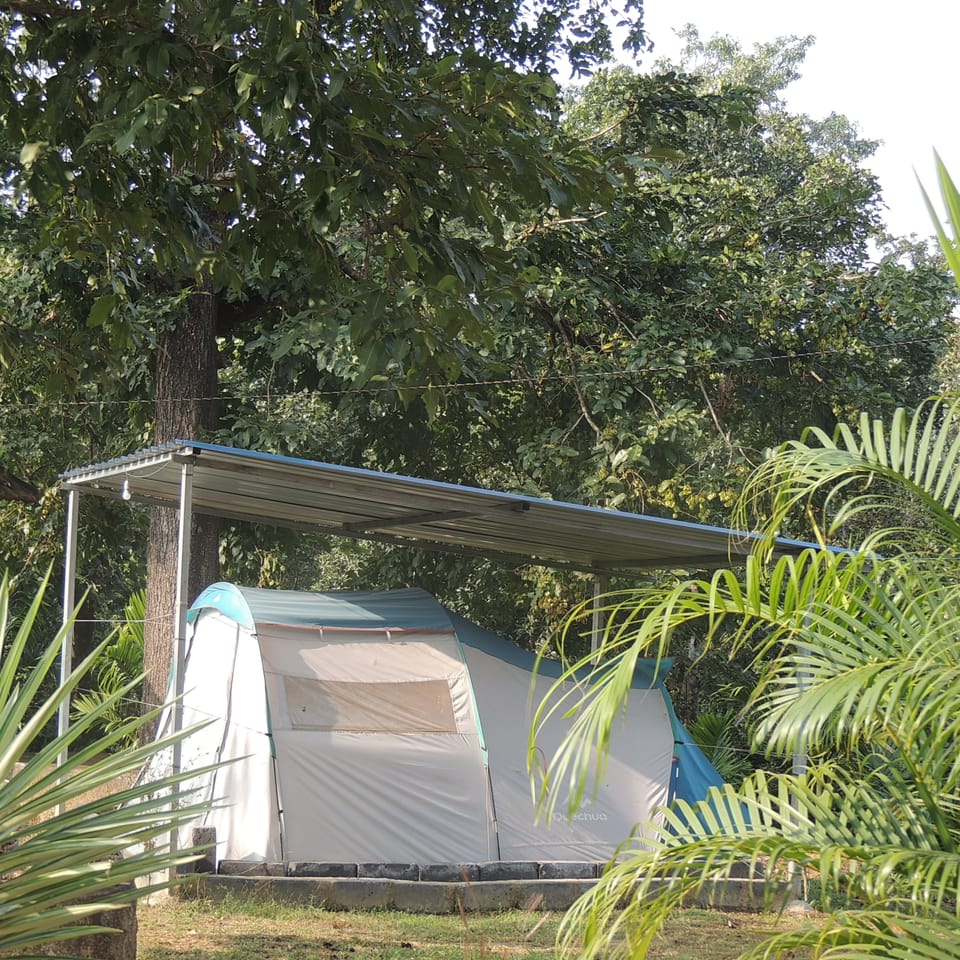 Deluxe Tent, Shared Bathroom | Desk, blackout drapes, bed sheets