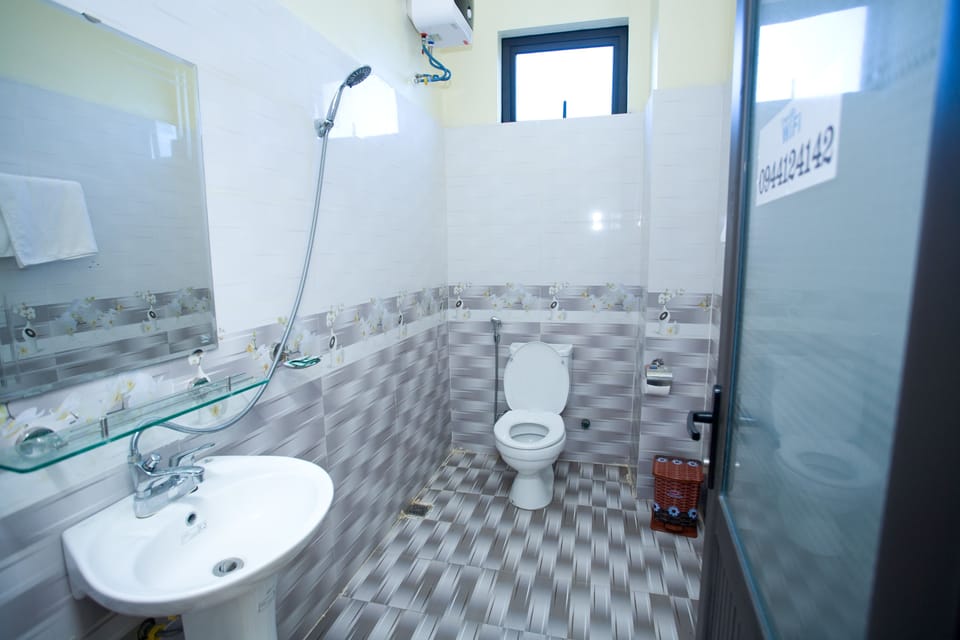 Shower, free toiletries, slippers, towels