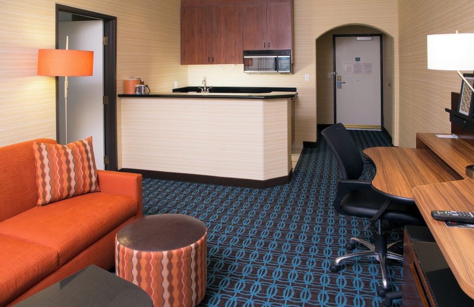 Suite, 1 King Bed with Sofa bed, Hearing Accessible (Accessible Bathtub) | Premium bedding, desk, iron/ironing board, cribs (free)