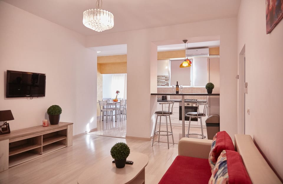 Deluxe Quadruple Room, 3 Bedrooms, Non Smoking, Balcony | Living area | 42-inch flat-screen TV with cable channels, TV