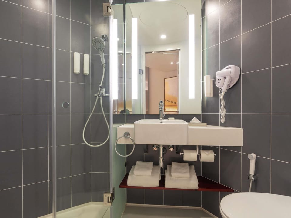 Shower, eco-friendly toiletries, hair dryer, towels