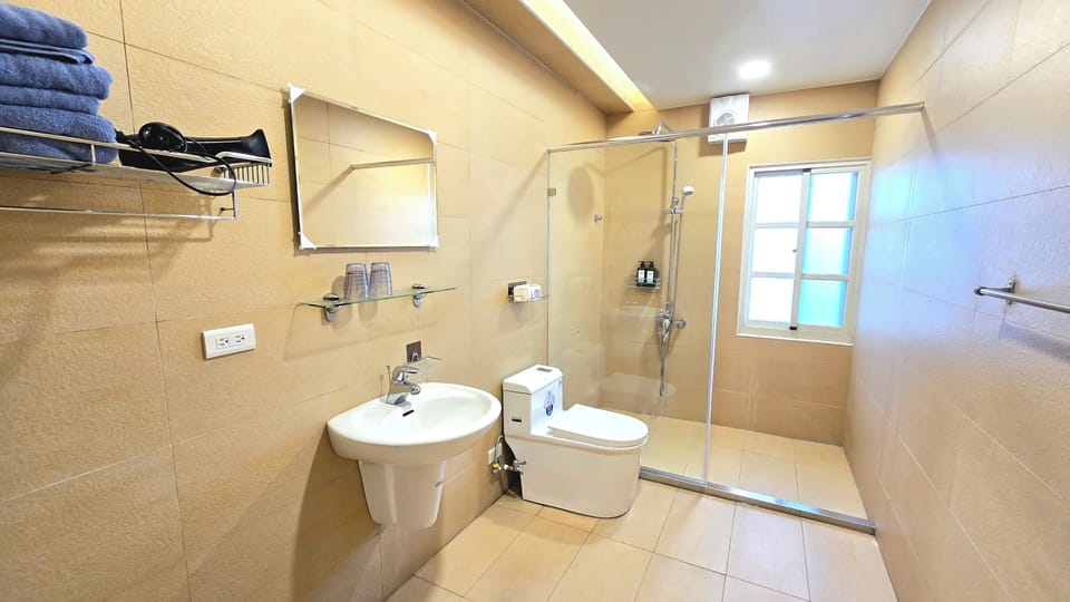 Elite Quadruple Room, 1 Bedroom, Non Smoking, Balcony | Bathroom | Free toiletries, hair dryer, slippers, towels