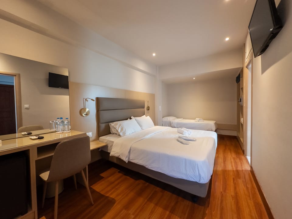 Quadruple Room | Premium bedding, minibar, in-room safe, individually furnished