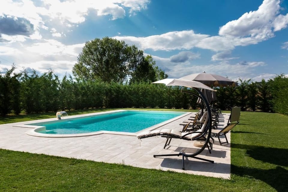 Seasonal outdoor pool, pool umbrellas, sun loungers