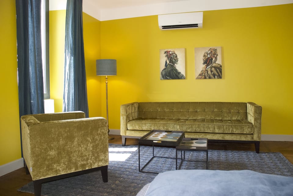 Deluxe Double Room | Living area | Flat-screen TV