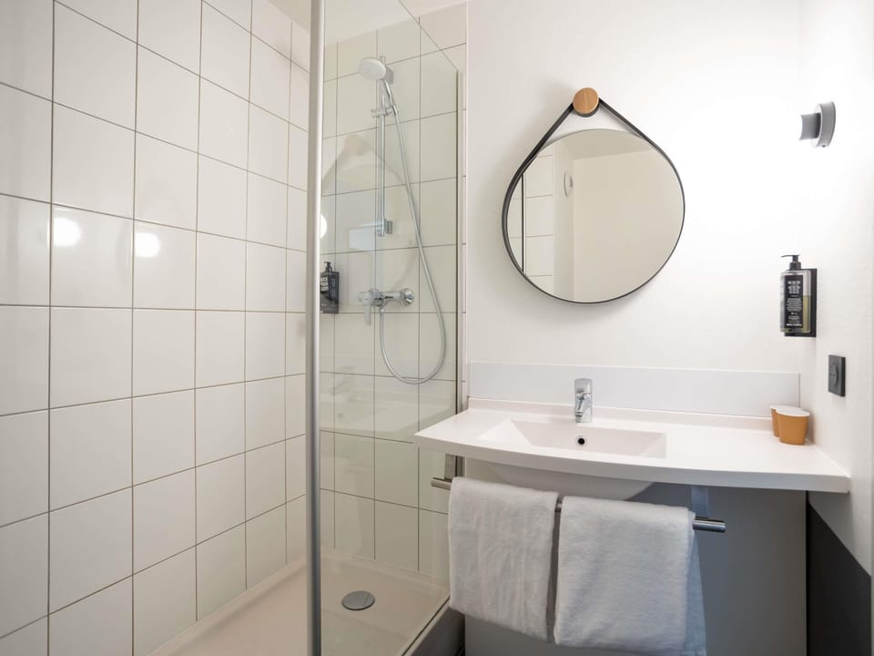 Bathtub, eco-friendly toiletries, hair dryer, towels