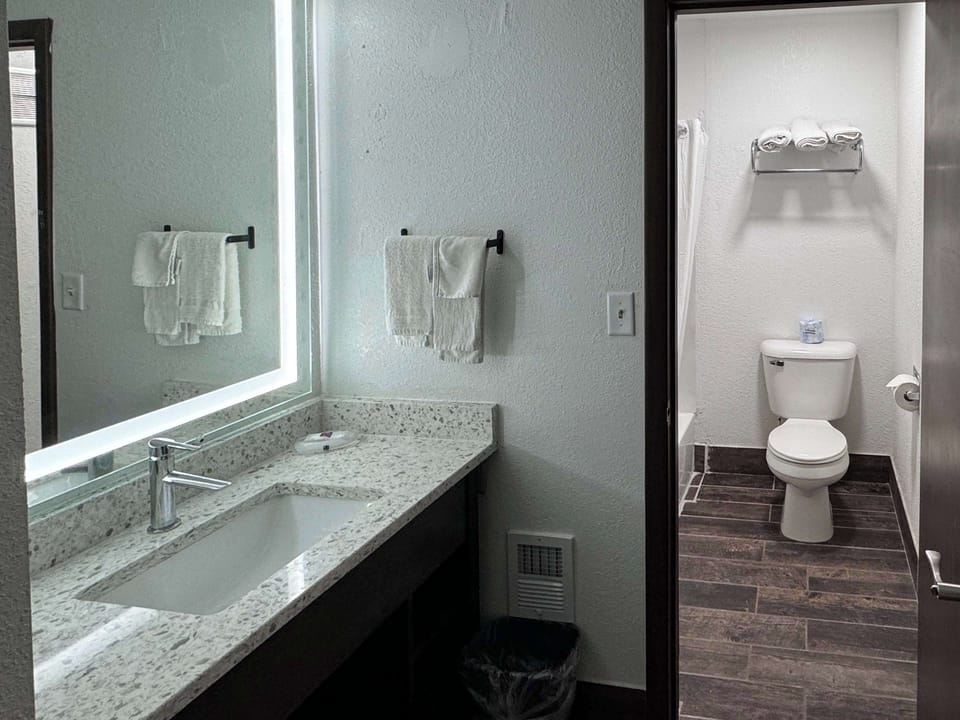 Shower, hair dryer, towels, shampoo