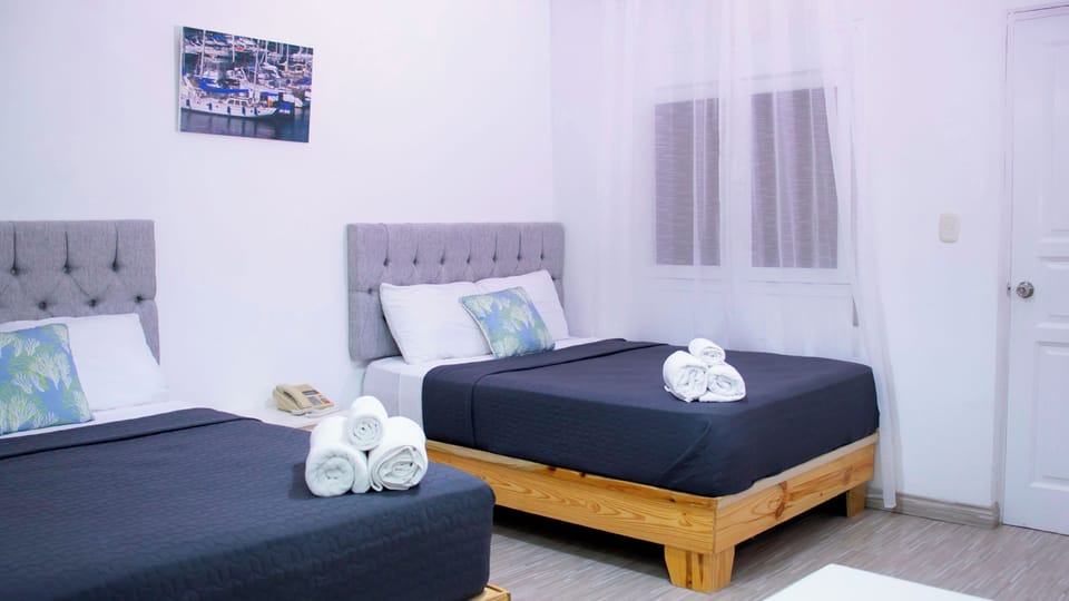 Family Room | Minibar, in-room safe, individually furnished, iron/ironing board