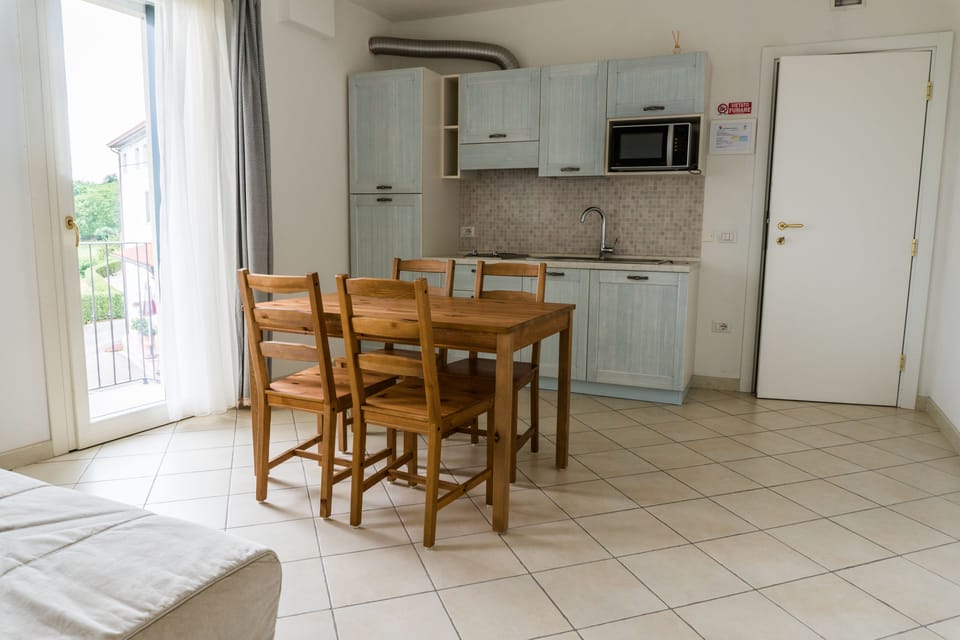 Apartment, 1 Bedroom, Balcony | Living area | Flat-screen TV, heated floors