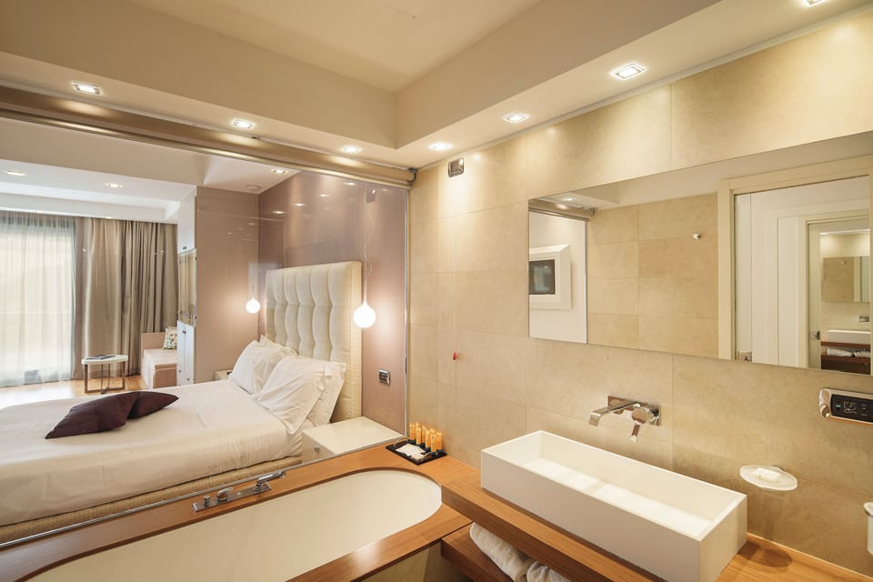 Junior Suite, Partial Sea View | Minibar, in-room safe, blackout drapes, soundproofing
