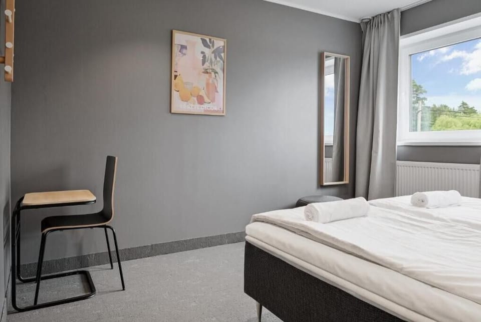 Standard Twin Room, 2 Twin Beds, Shared Bathroom | Blackout drapes, soundproofing, WiFi (free), bed sheets