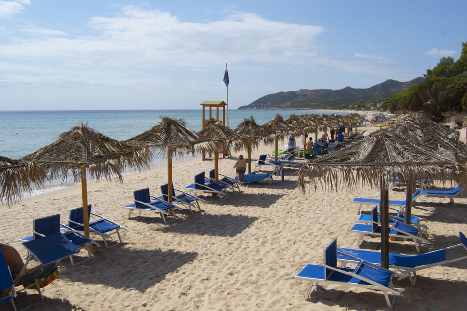Private beach, white sand, sun loungers, beach umbrellas