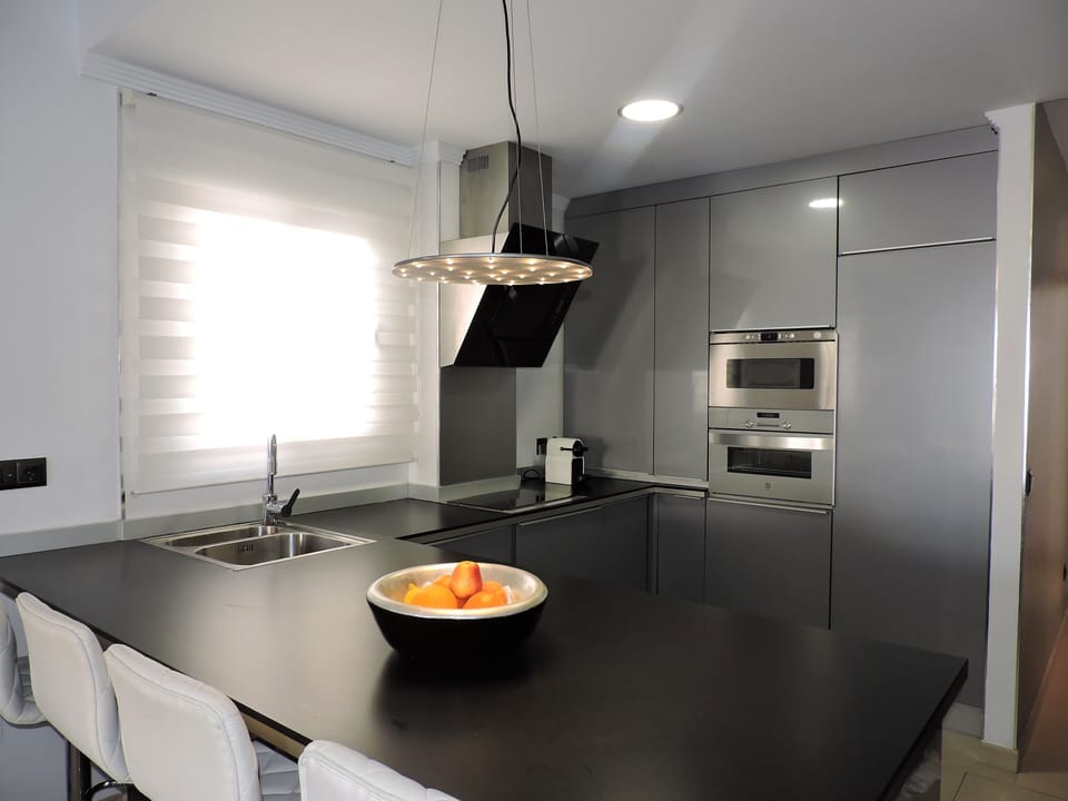 Exclusive Apartment | Living area | 55-inch TV with digital channels, books