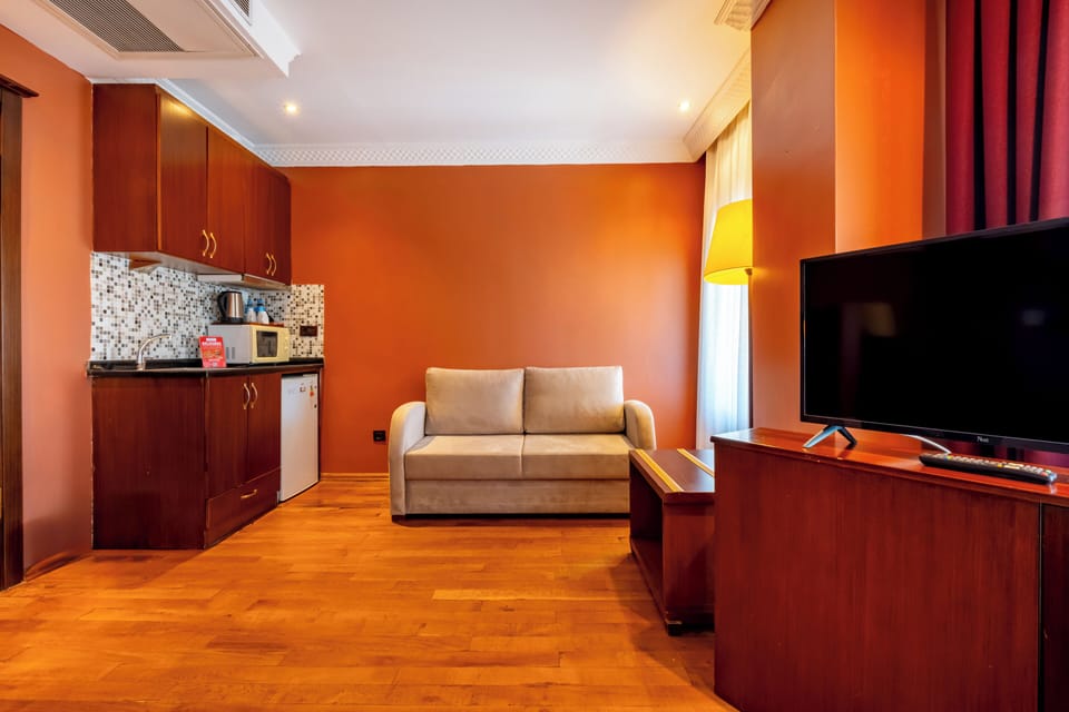 Comfort Triple Room, 1 Bedroom | Living area | LCD TV